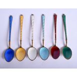 A SET OF DANISH SILVER GILT AND ENAMEL SPOONS. (6)
