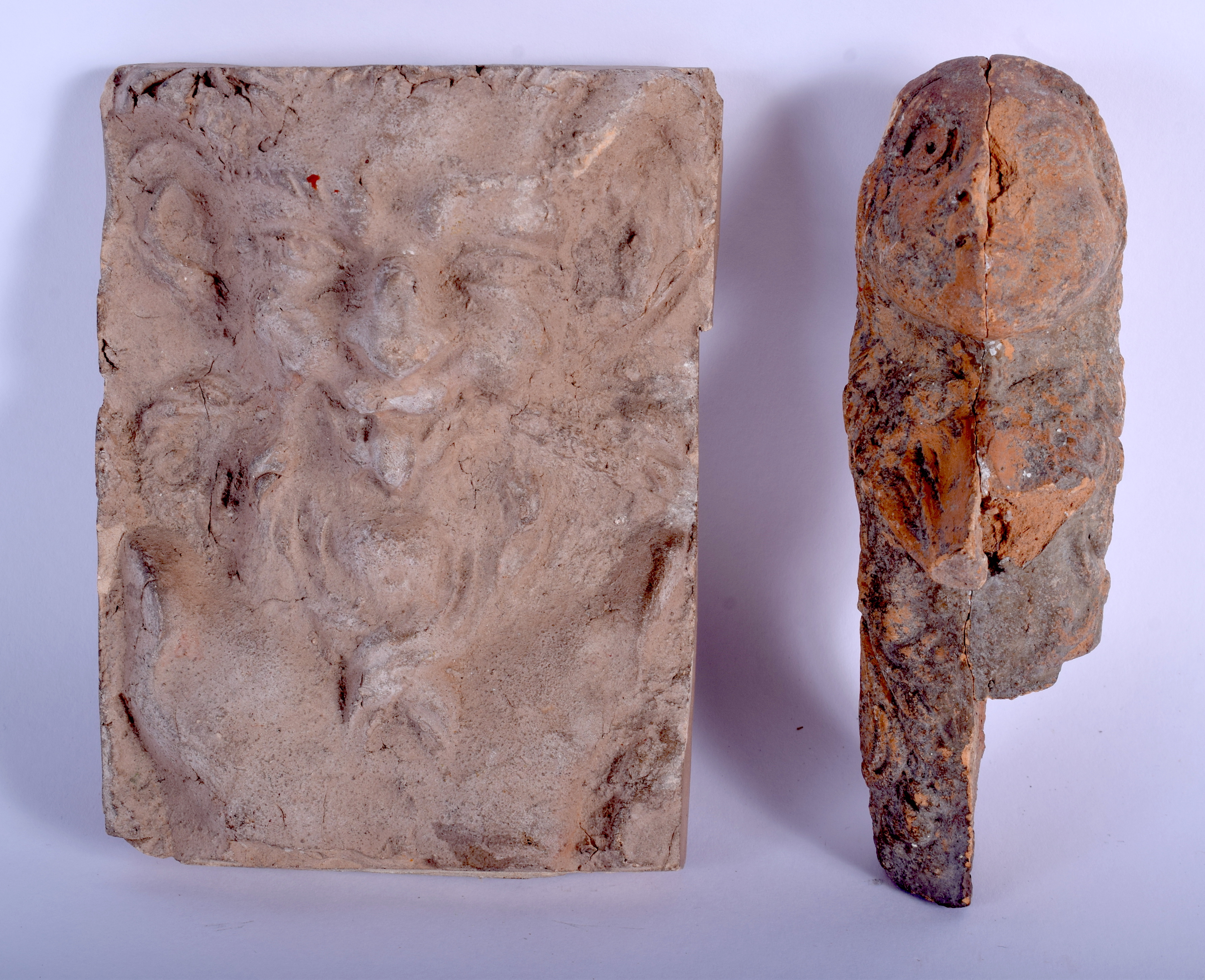 TWO LARGE SOUTH EUROPEAN CARVED TERRACOTTA FRAGMENTS possibly Roman. Largest 10 cm x 12 cm. (2)