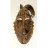 A TRIBAL YAURE MASK. Ivory Coast. 16cm x 10cm x 31cm