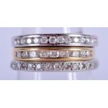 THREE GOLD DIAMOND ETERNITY RINGS. J. 6.2 grams. (3)