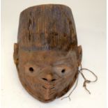 A TRIBAL YORUBA GELEDE HELMET MASK. Nigeria. 19cm x 13cm x 33cm