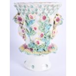 AN 18TH CENTURY BOW FRILL VASE with pierced rim and moulded heads and flowers. 15 cm high.