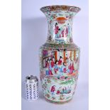 A LARGE 19TH CENTURY CHINESE CANTON FAMILLE ROSE VASE Qing, painted with figures in a landscape. 44