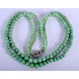 A 1930S IMITATION JADEITE GLASS BEAD NECKLACE. 46 cm long.