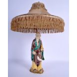 A 19TH CENTURY CHINESE SANCAI GLAZED POTTERY IMMORTAL converted to a lamp. Figure 30 cm high.