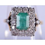 AN 18CT GOLD DIAMOND AND EMERALD RING. N. 5.7 grams. Emerald 1 cm x 0.5 cm.