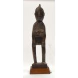 A TRIBAL MOSSI FIGURE. Burkina Faso. 12cm x 10cm x 38cm