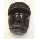 A TRIBAL DAN-KRAN MASK. Ivory Coast. 18cm x 13cm x 24cm