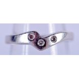 A PLATINUM AND DIAMOND RING. J. 4.3 grams.