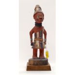 A TRIBAL YORUBA FIGURE. Nigeria. 14cm x 15cm x 38cm