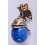 A CONTINENTAL SILVER GILT HELMET FORM LAPIS PENDANT. 4 cm x 2 cm.