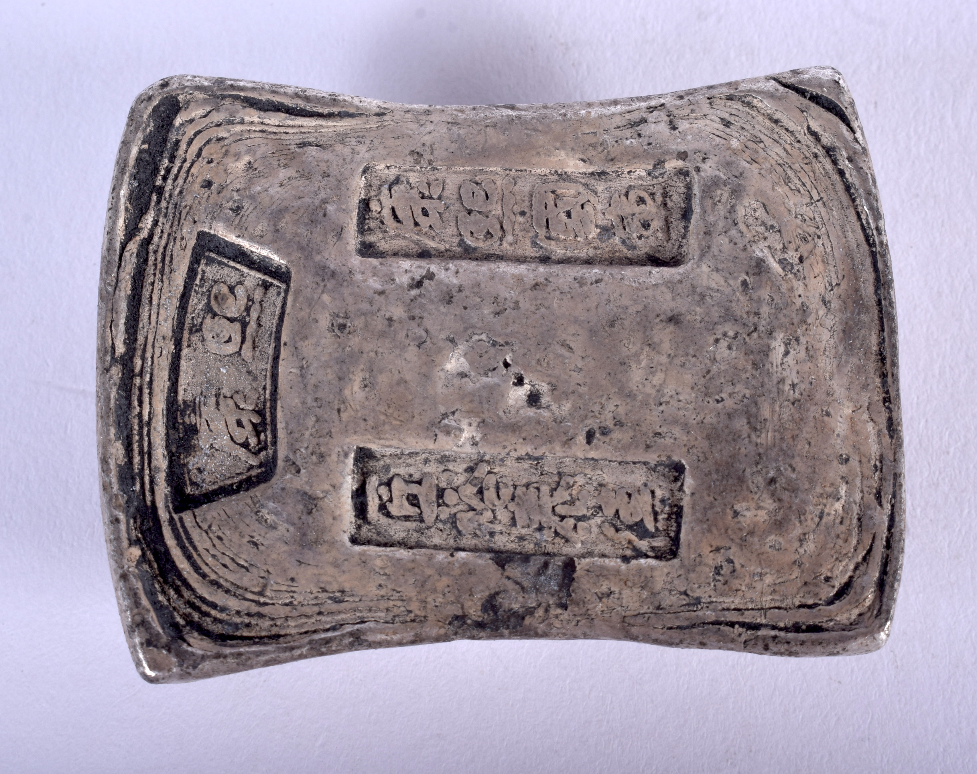 A CHINESE WHITE METAL INGOT. 202 grams. 6 cm x 4 cm.