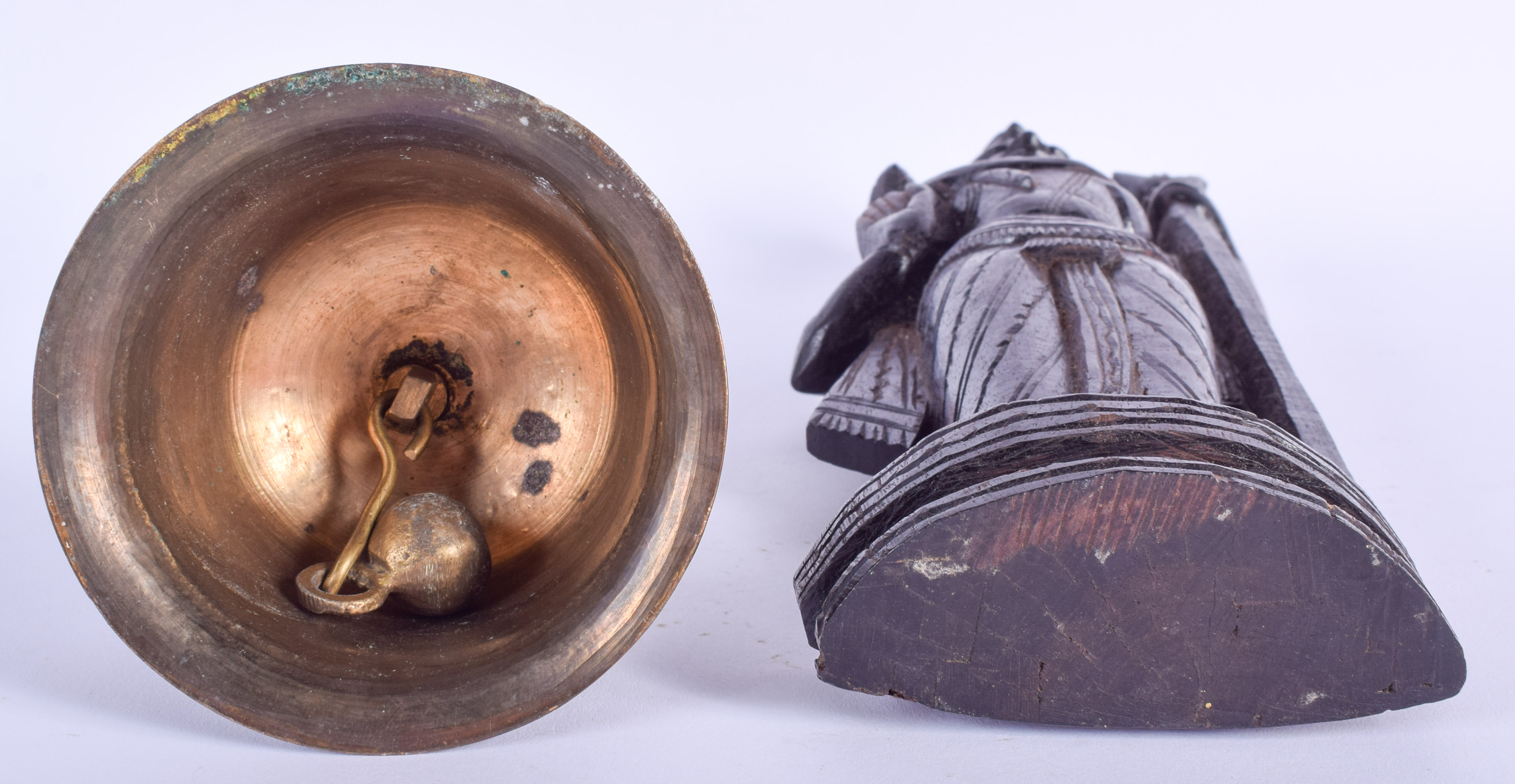 A 19TH CENTURY INDIAN CARVED HARDWOOD FIGURE OF A DEITY together with a similar bell. 23 cm & 16 cm - Image 3 of 3