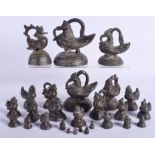 A RARE SET OF 19TH CENTURY INDIAN GRADUATED BRONZE WEIGHTS in the form of birds. Largest 15 cm x 11