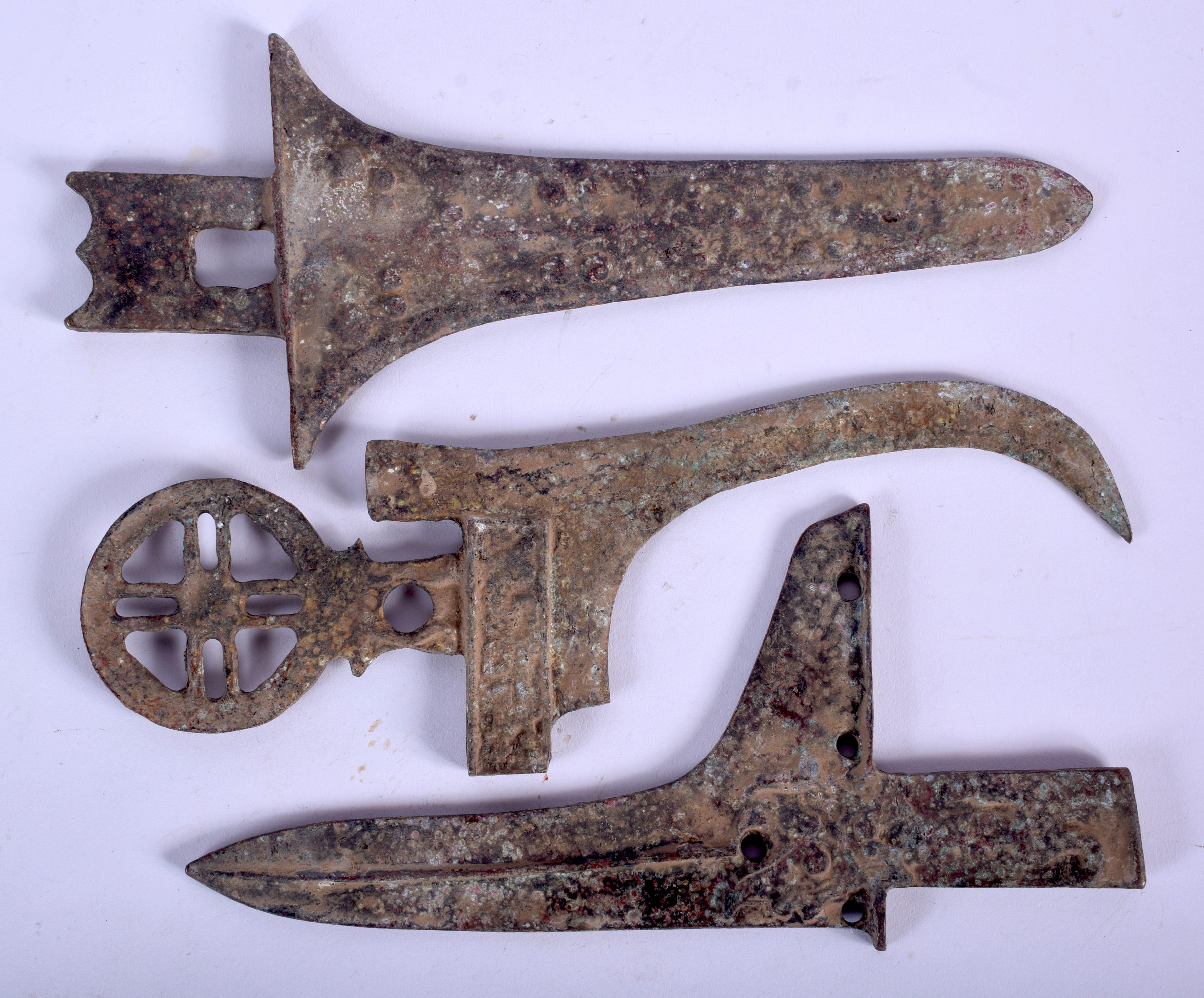 THREE CHINESE BRONZE WEAPON FRAGMENTS. Largest 22 cm long. (3)