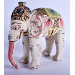 AN EARLY 20TH CENTURY INDIAN POLYCHROMED WOODEN ELEPHANT possibly Rajasthan. 27 cm x 27 cm.