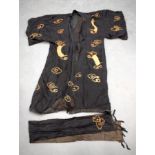 A JAPANESE SILK KIMONO together with two Middle Eastern silk panels. (3)