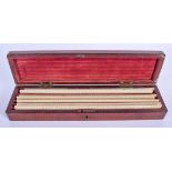 A CASED VICTORIAN IVORY RULER SET within a mahogany box. (8)