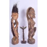 A PAIR OF CONTINENTAL TRIBAL FIGURES together with a Haida type figure. Largest 46 cm high. (3)