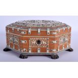 A MID 19TH CENTURY ANGLO INDIAN CARVED IVORY AND SANDALWOOD OCTAGONAL BOX decorated with flowers and