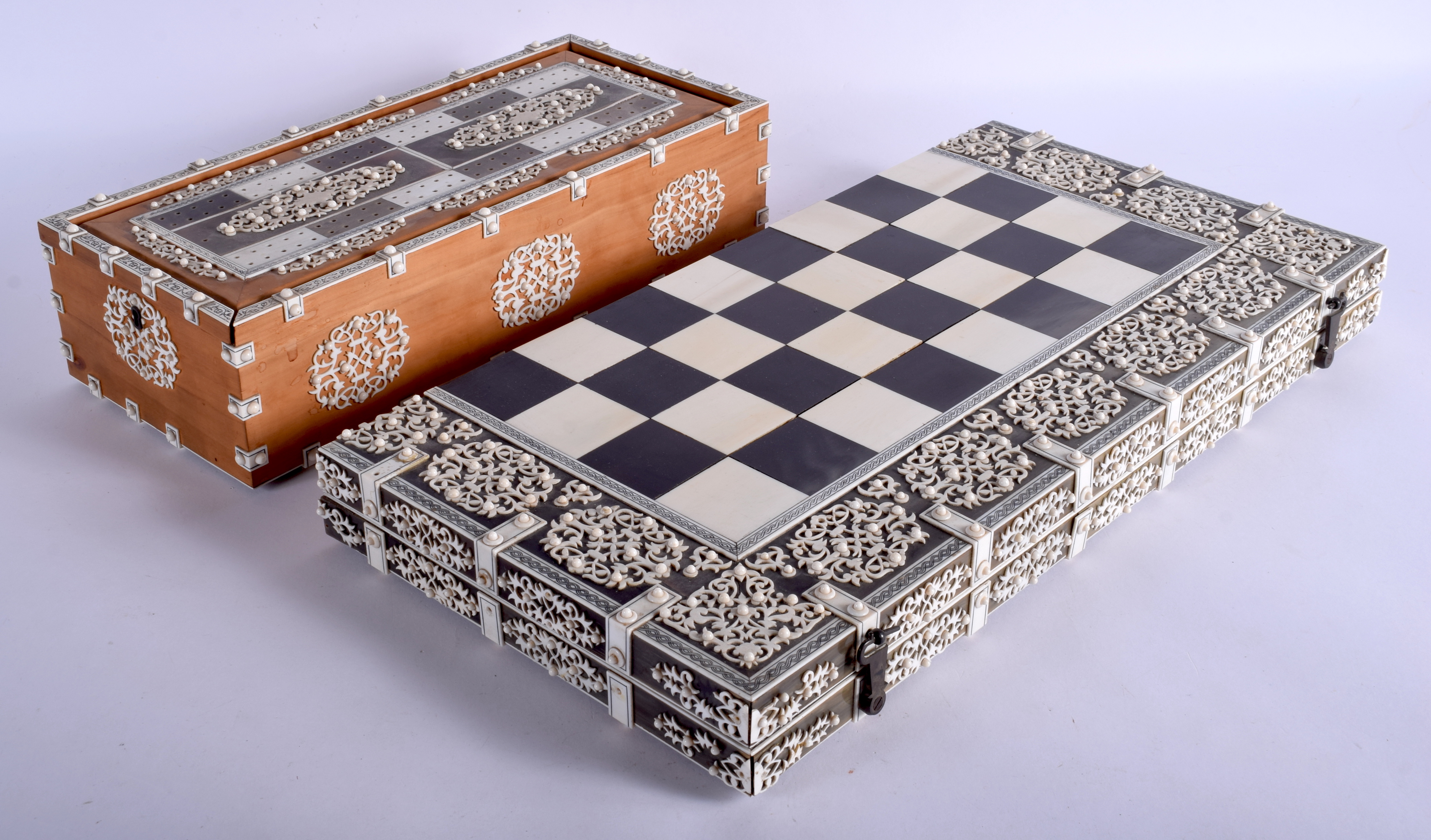 A MAJESTIC 19TH CENTURY ANGLO INDIAN CARVED IVORY AND RHINOCEROS HORN GAMES BOARD C1850 with matchin