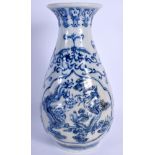 A 19TH CENTURY JAPANESE MEIJI PERIOD BLUE AND WHITE VASE decorated with dragons. 22 cm high.