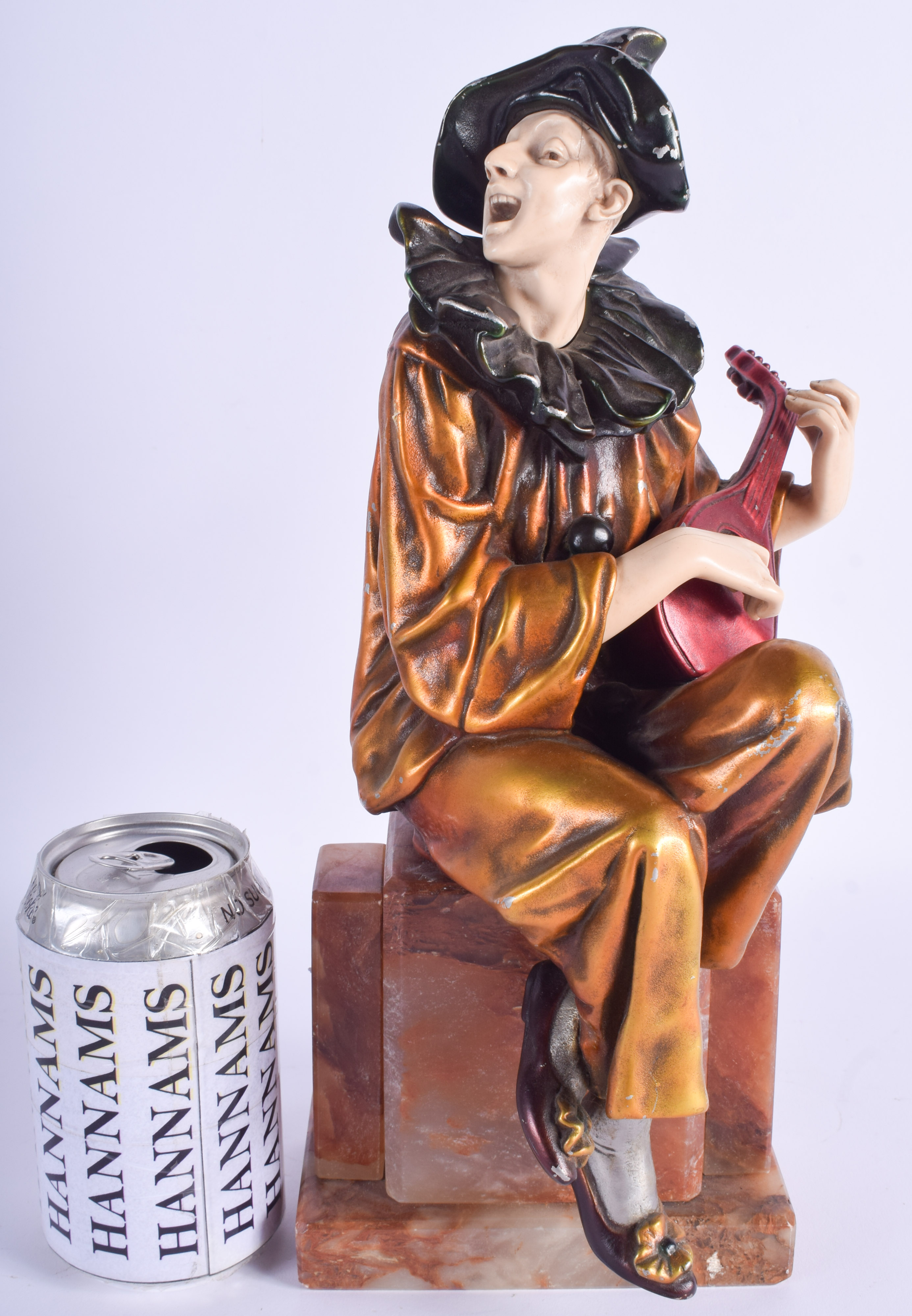 AN ART DECO COLD PAINTED METAL AND IVORINE FIGURE OF A MUSICIAN. 34 cm x 12 cm.