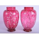 A PAIR OF ANTIQUE ENAMELLED CRANBERRY GLASS VASES. 19 cm high.