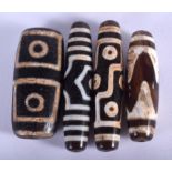 FOUR CHINESE TIBETAN ZHU BEADS. Largest 4.5 cm wide. (4)