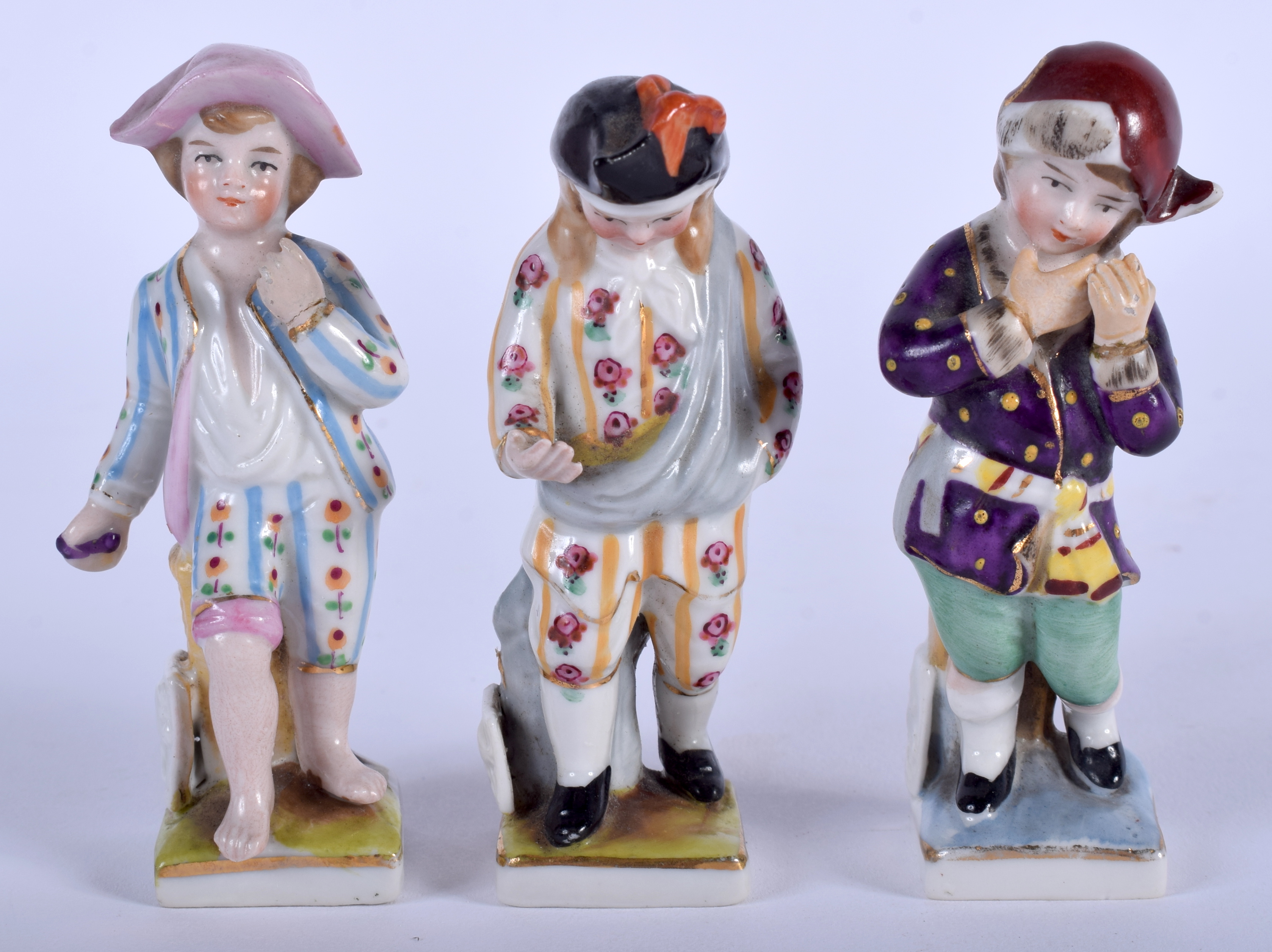 THREE ANTIQUE GERMAN PORCELAIN FIGURES. 8 cm high. (3)