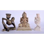 AN EARLY 20TH CENTURY INDIAN SOAPSTONE BUDDHA together with two others. Largest 13 cm high. (3)