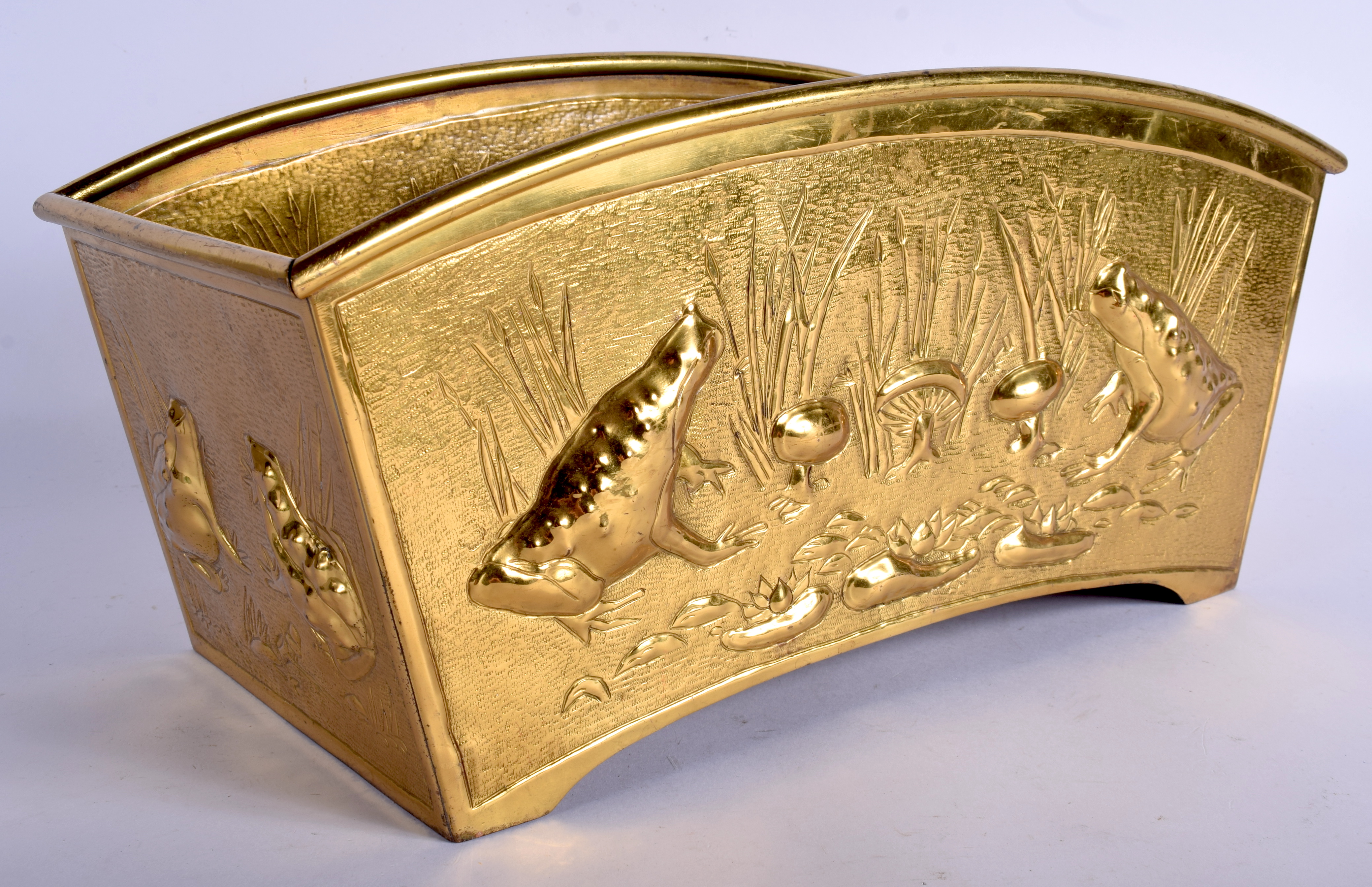 AN ARTS AND CRAFTS BRASS PLANTER. 36 cm x 20 cm.