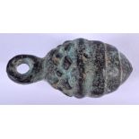 A CHINESE BRONZE WEIGHT. 7 cm long.