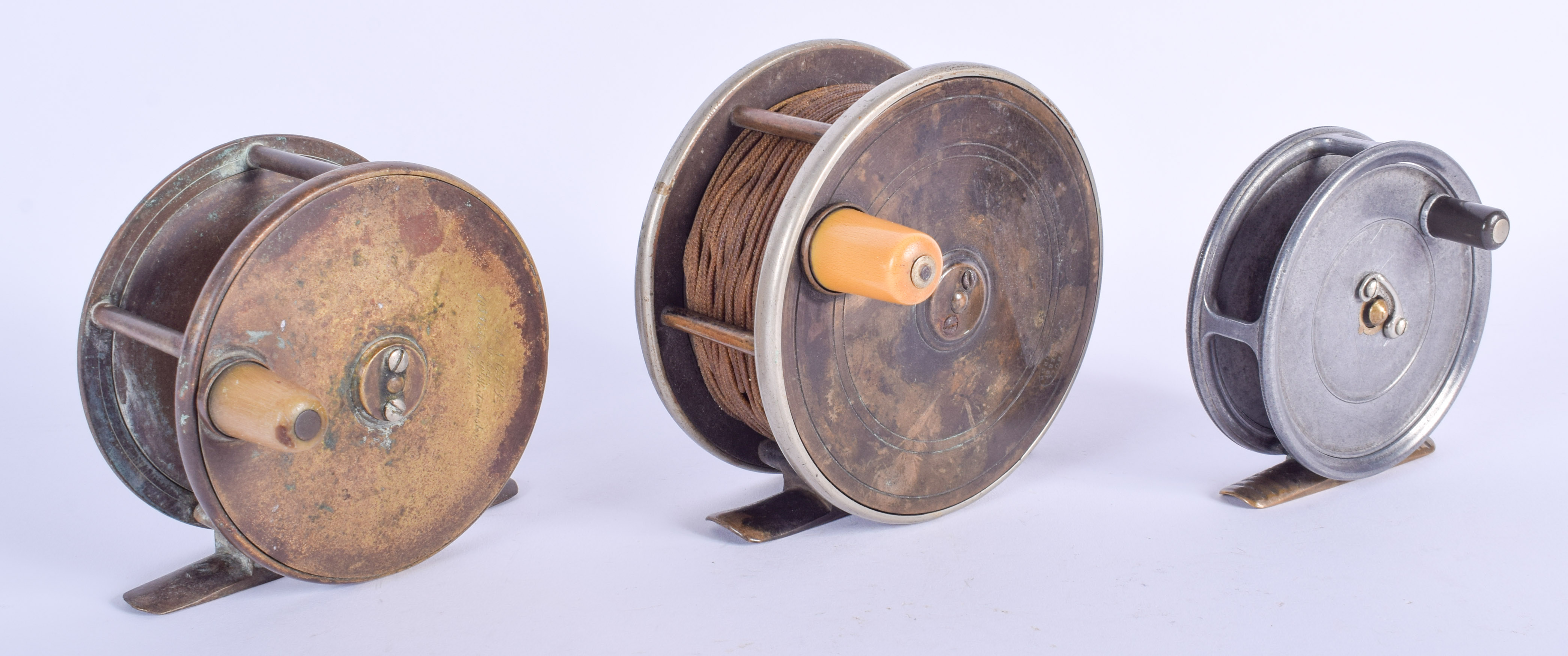 THREE VINTAGE FISHING REELS. (3)