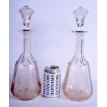 A LARGE PAIR OF VICTORIAN ENGRAVED GLASS DECANTERS AND STOPPERS decorated with birds and foliage. 35