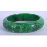 A CHINESE APPLE JADE BANGLE. 7.25 cm wide.