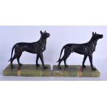 A PAIR OF ART DECO SPELTER HOUNDS upon onyx bases. 21 cm x 21 cm.