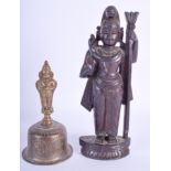 A 19TH CENTURY INDIAN CARVED HARDWOOD FIGURE OF A DEITY together with a similar bell. 23 cm & 16 cm