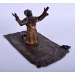 A 19TH CENTURY AUSTRIAN COLD PAINTED BRONZE FIGURE OF A TURKISH MALE modelled upon a carpet. 17 cm x