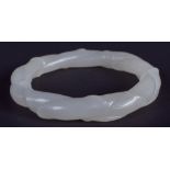 AN EARLY 20TH CENTURY CHINESE CARVED WHITE TWIST JADE BANGLE Late Qing. 7.75 cm wide.