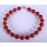 A CHINESE RED BEAD NECKLACE. 30 cm long.