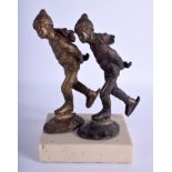 A PAIR OF BRONZE SKATERS. Bronze 15 cm high.