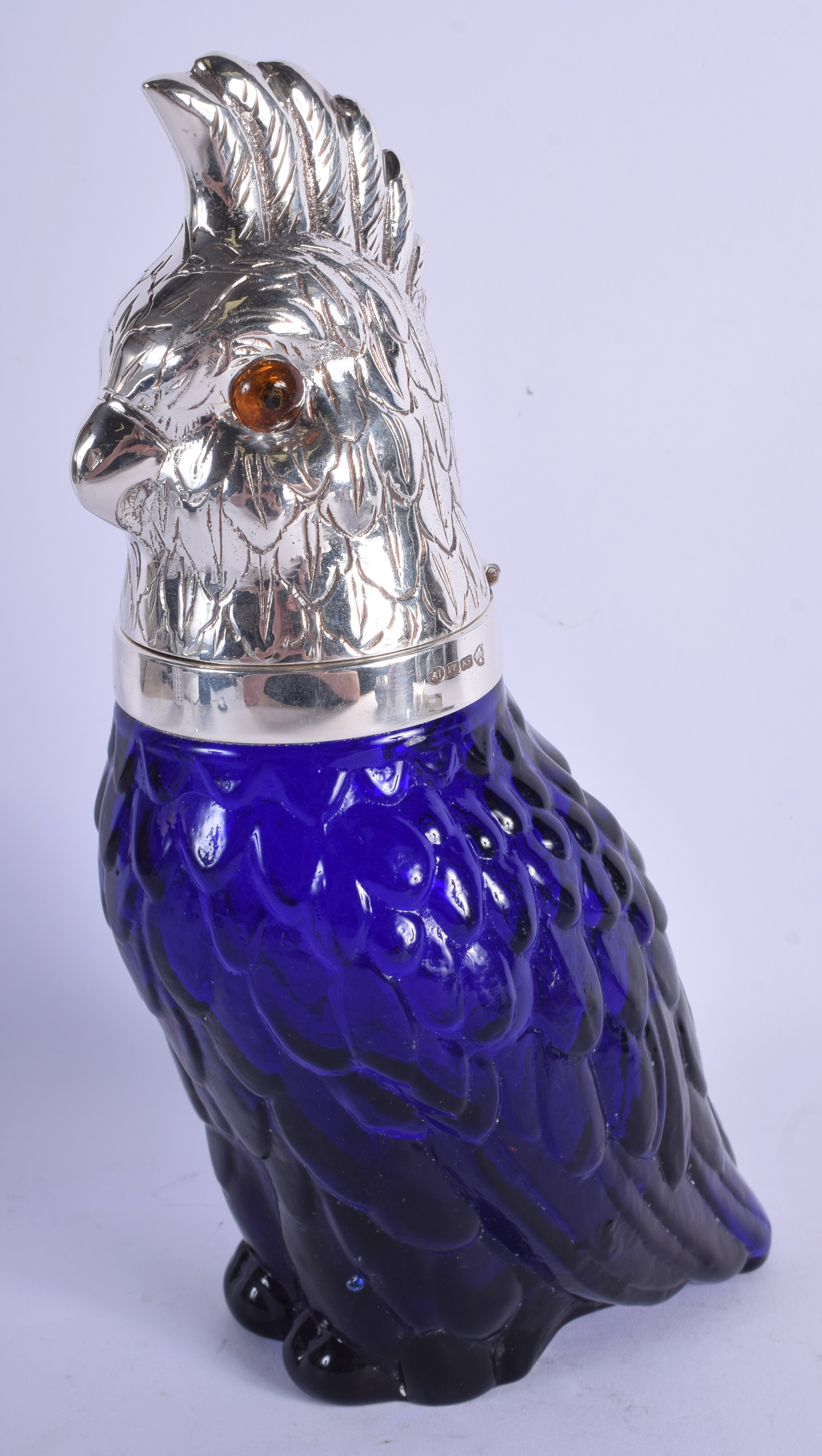 A CONTEMPORARY SILVER PLATED BLUE GLASS PARROT DECANTER. 27 cm high.