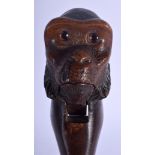 A RARE PAIR OF 19TH CENTURY BAVARIAN BLACK FOREST NUT CRACKERS in the form of an ape. 20 cm long.