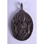 A CONTINENTAL SILVER SAINT PENDANT. 2.75 cm x 4 cm.