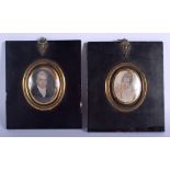 A PAIR OF GEORGE III PAINTED IVORY PORTRAIT MINIATURES. Image 5 cm x 7.5 cm.