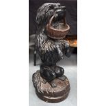 A RARE 19TH CENTURY BAVARIAN BLACK FOREST CARVED WOOD BEGGING DOG modelled as a basket within its mo