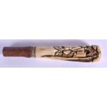A 19TH CENTURY JAPANESE MEIJI PERIOD CARVED STAG ANTLER CANE HANDLE decorated with figures. 15 cm lo