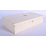 A LARGE EARLY 20TH CENTURY CARVED IVORY JEWELLERY BOX with central monogram. 30 cm x 15 cm.