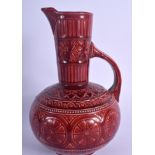 AN ARTS AND CRAFTS SAMUEL LEAR RUBY POTTERY AESTHETIC MOVEMENT JUG designed for Christopher Dresser.